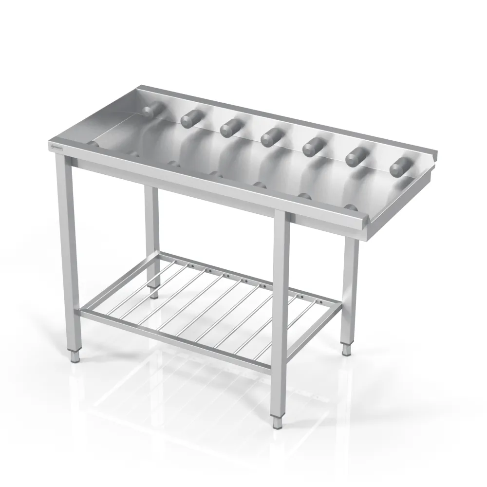 Table avec des petits rouleaux et une grille en dessous 2500